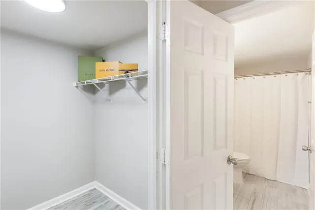 a view of a hallway with paintings on the wall