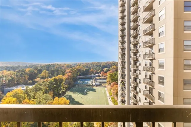 a living room with furniture and a dining table