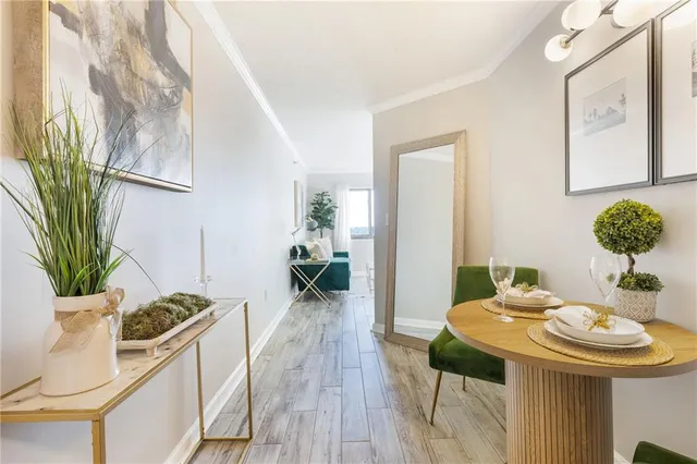 a view of a dining room with furniture and wooden floor