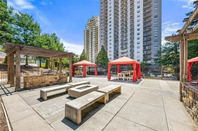 a view of a park with plants and bench