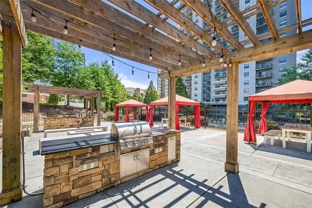 a view of backyard with outdoor seating and green space