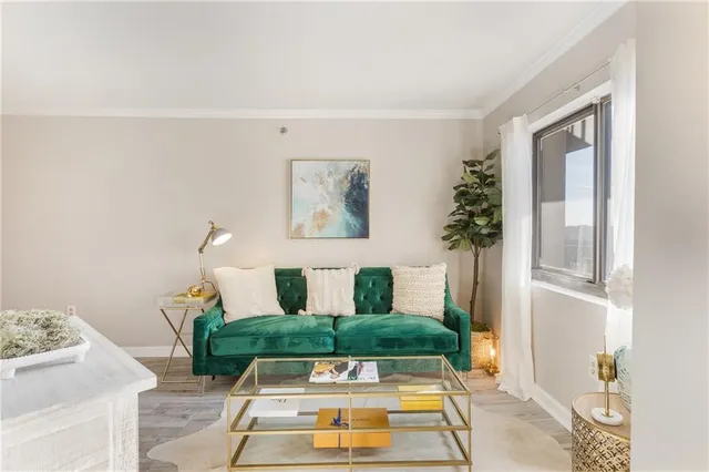 a view of living room with furniture and wooden floor