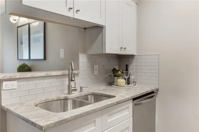 a kitchen with a sink and cabinets