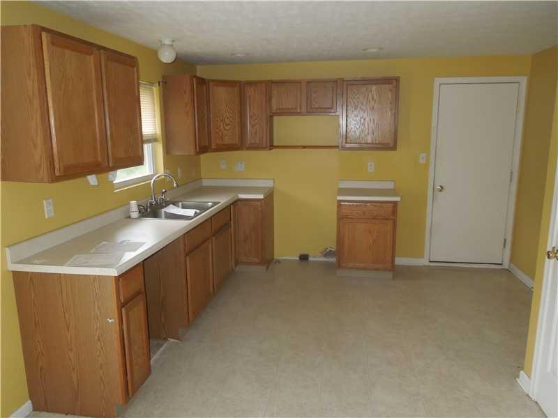 189 Profio Road McDonald, PA 15057 - Photo 8 of 25 Kitchen. door on right is a pantry, door on far wall leads to two car garage