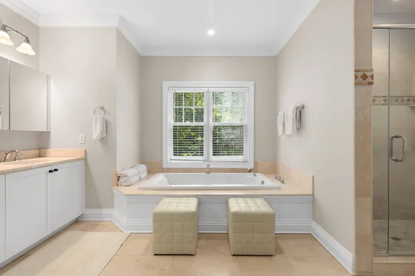 a white bath tub sitting next to a white sink