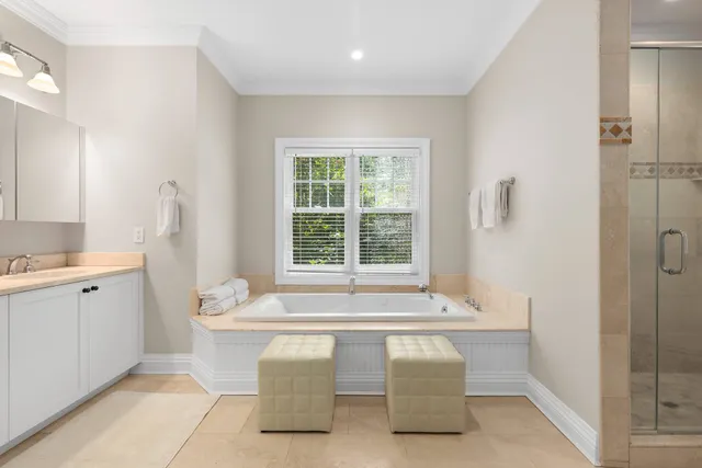 a white bath tub sitting next to a white sink