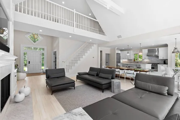 a living room with furniture and a fireplace