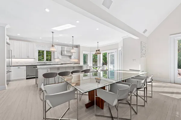 a kitchen with a table and chairs in it