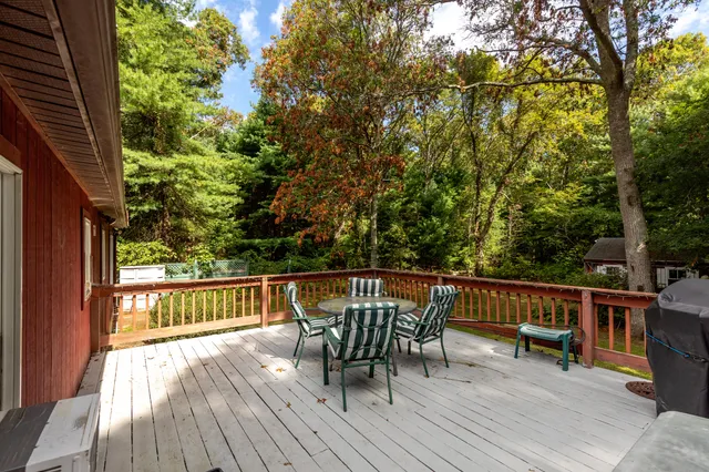a view of a wooden deck with furniture