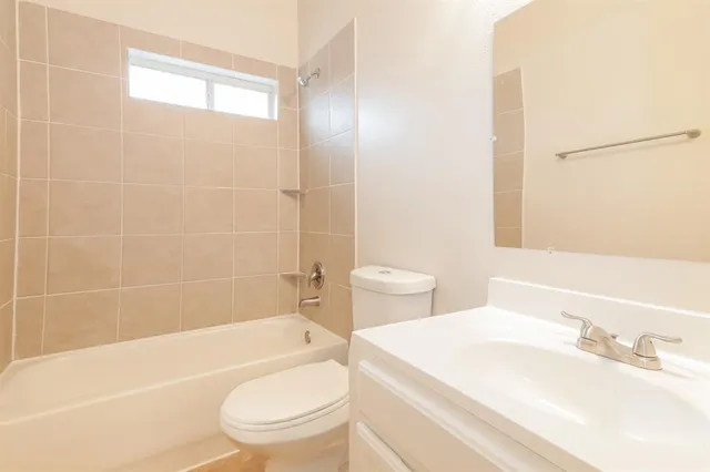 a bathroom with a sink a toilet and a bathtub