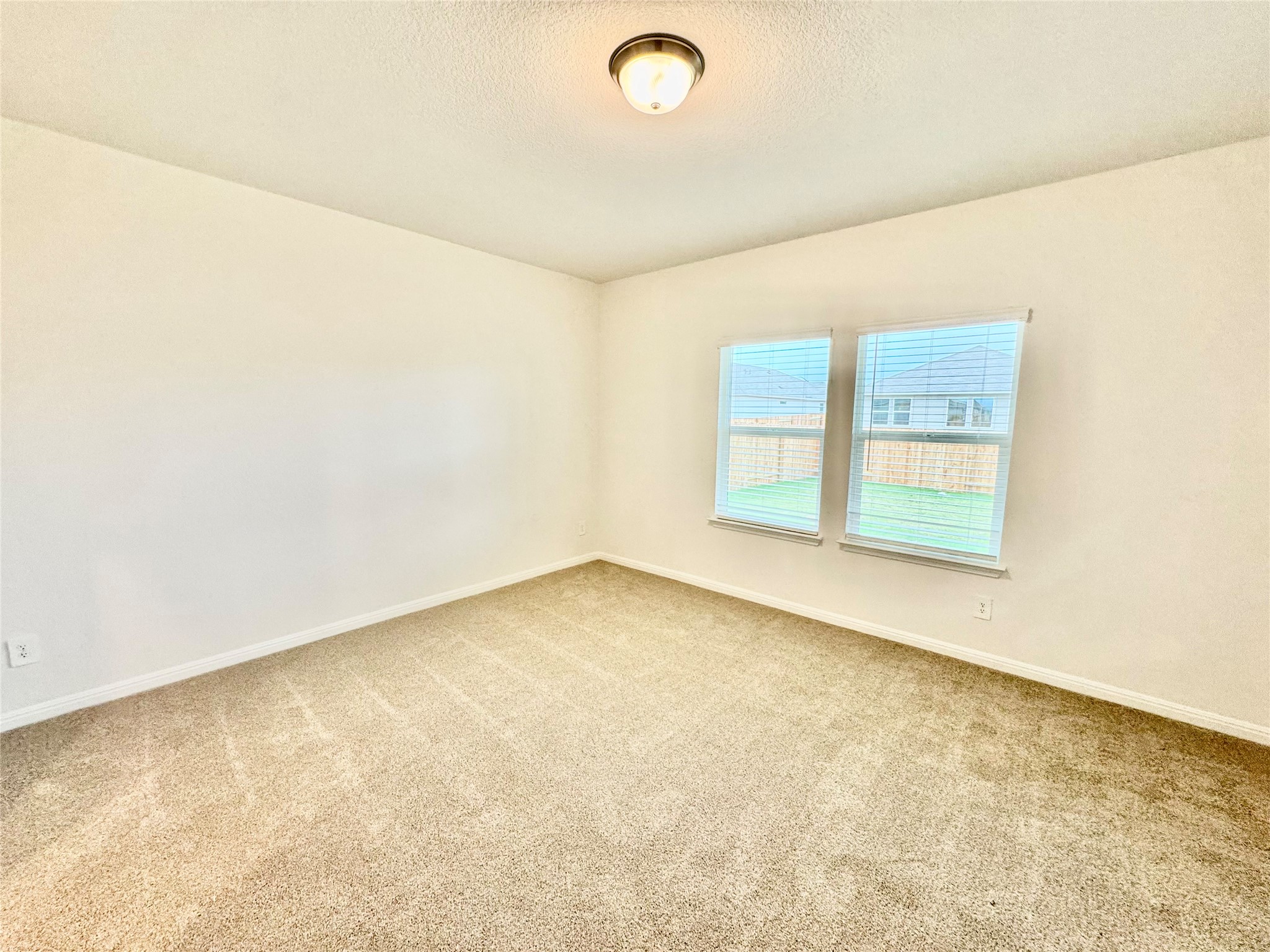 Undisclosed Address Kyle, TX 78640 - Photo 3 of 17 Spare room with carpet and a textured ceiling