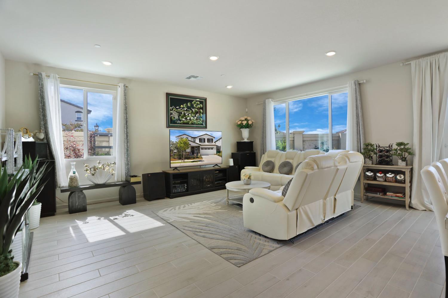 6949 Foraker Drive Stockton, CA 95219 - Photo 6 of 34 a living room with furniture and a flat screen tv