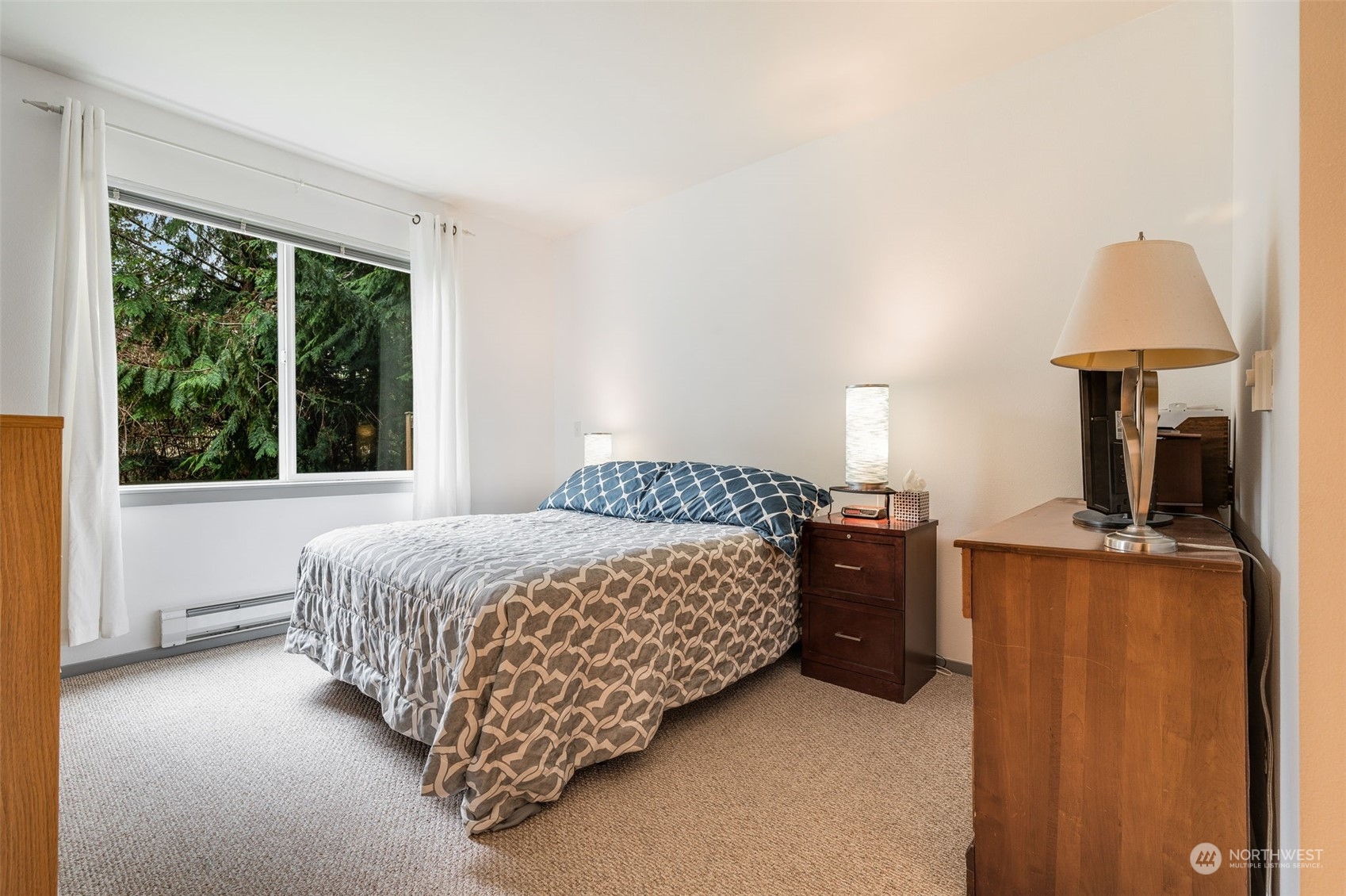 2009 196th Street Southeast, Unit F102 Bothell, WA 98012 - Photo 12 of 18 a bedroom with a bed and a window
