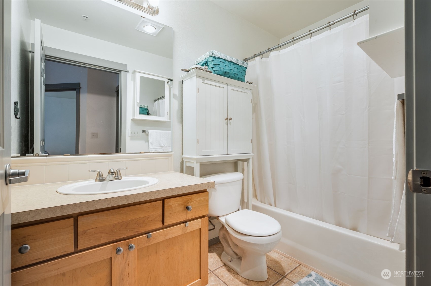2009 196th Street Southeast, Unit F102 Bothell, WA 98012 - Photo 15 of 18 a bathroom with a sink toilet vanity and shower