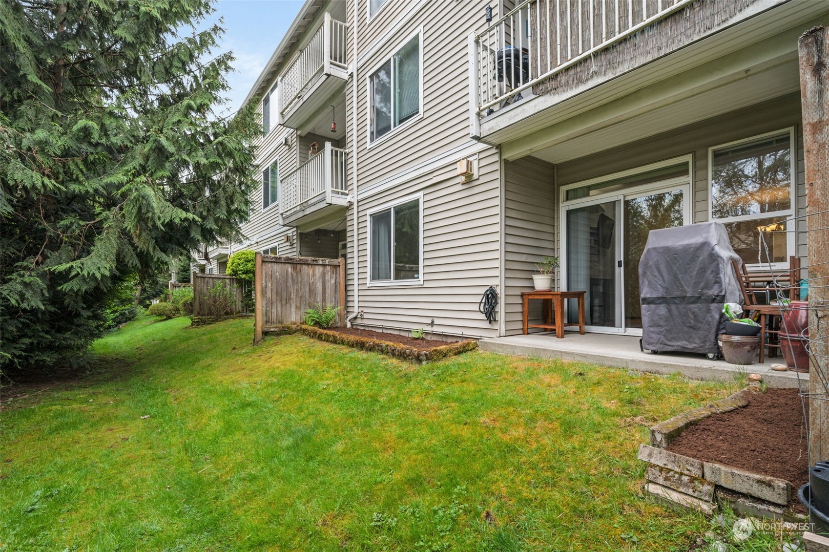 2009 196th Street Southeast, Unit F102 Bothell, WA 98012 - Photo 17 of 18 a house view with a garden space