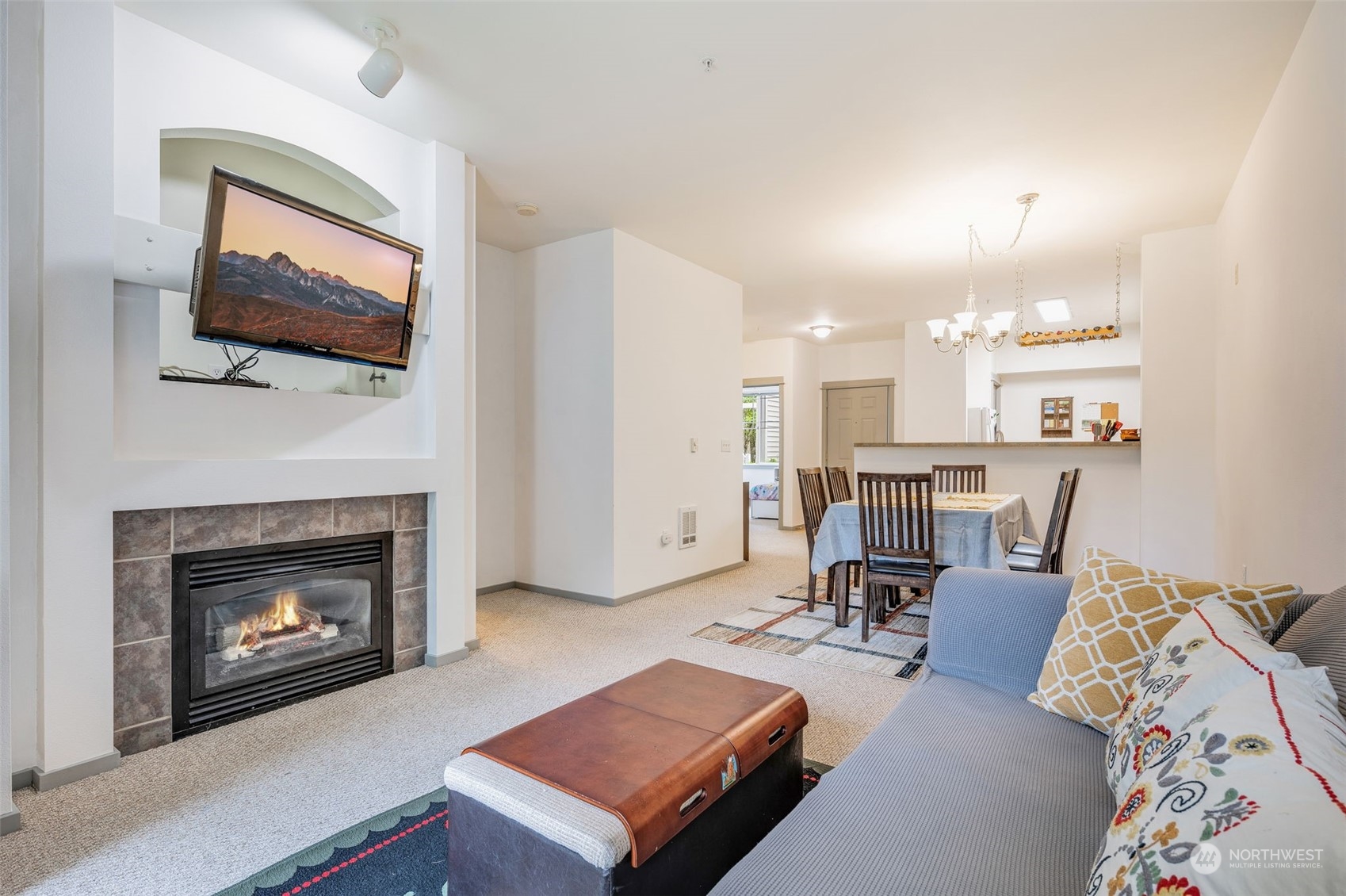 2009 196th Street Southeast, Unit F102 Bothell, WA 98012 - Photo 6 of 18 a living room with furniture and a fireplace