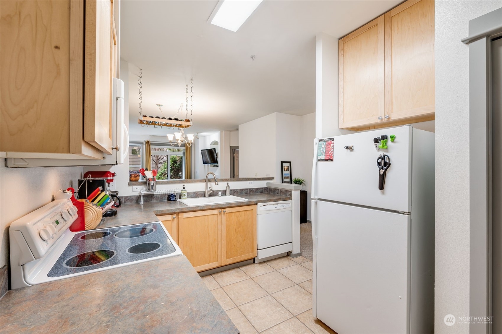 2009 196th Street Southeast, Unit F102 Bothell, WA 98012 - Photo 8 of 18 a kitchen with refrigerator a sink a stove and a refrigerator
