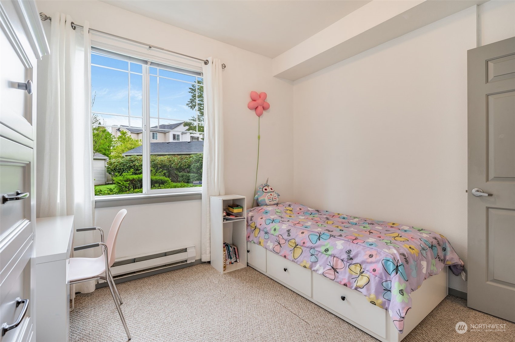 2009 196th Street Southeast, Unit F102 Bothell, WA 98012 - Photo 10 of 18 a bedroom with a bed and a window