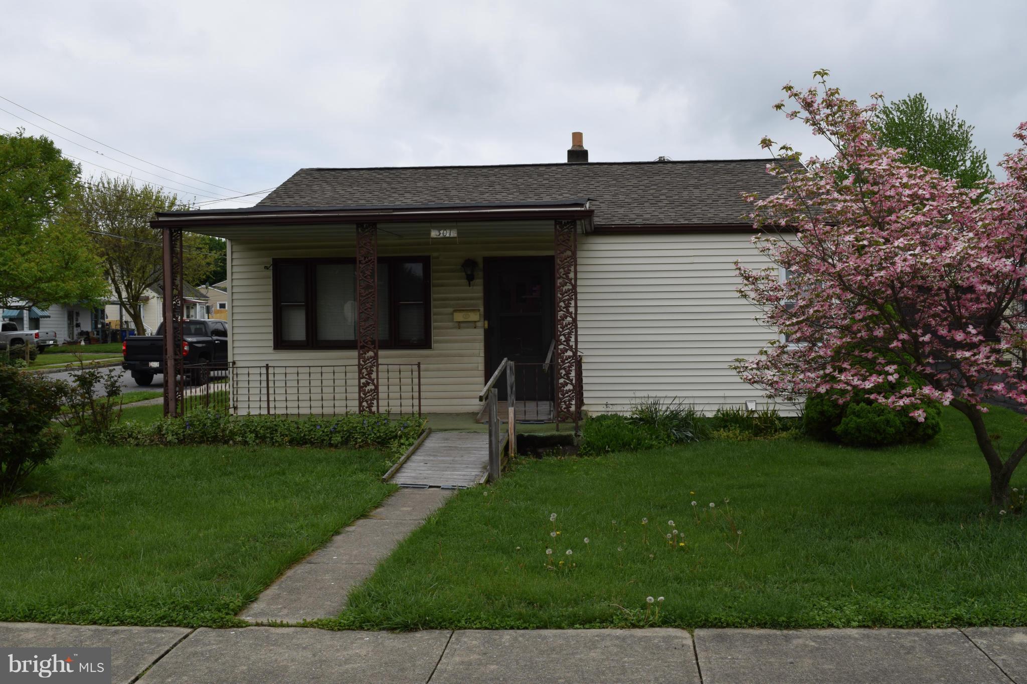 301 Nottingham Road Hagerstown, MD 21740 - Photo 1 of 11 a view of a house with a small yard and plants