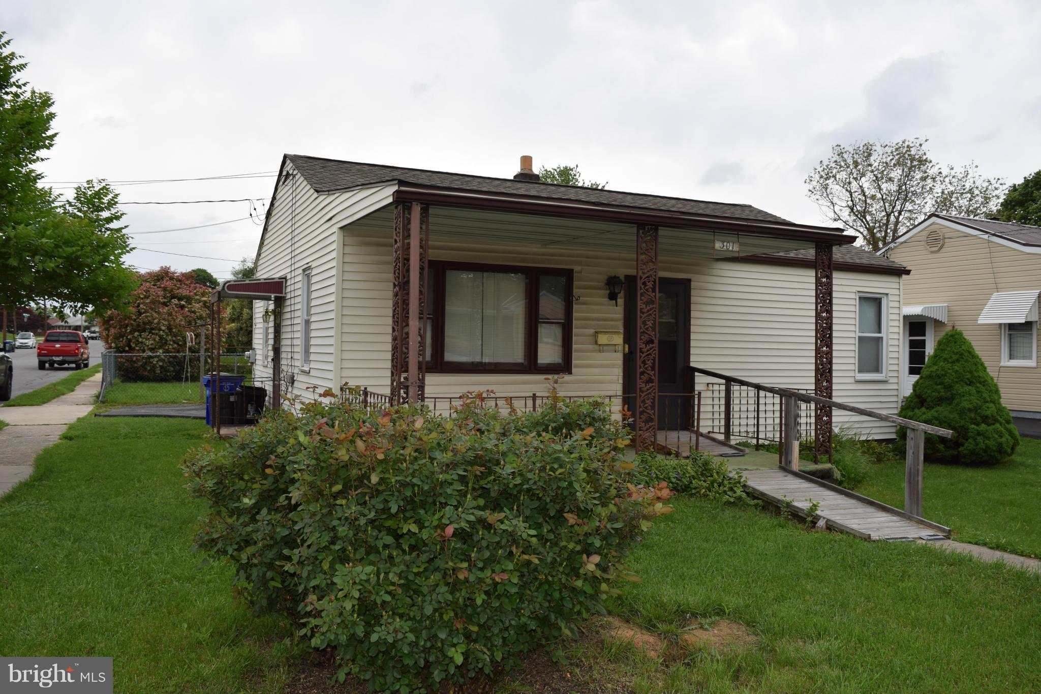 301 Nottingham Road Hagerstown, MD 21740 - Photo 2 of 11 a front view of house with a garden