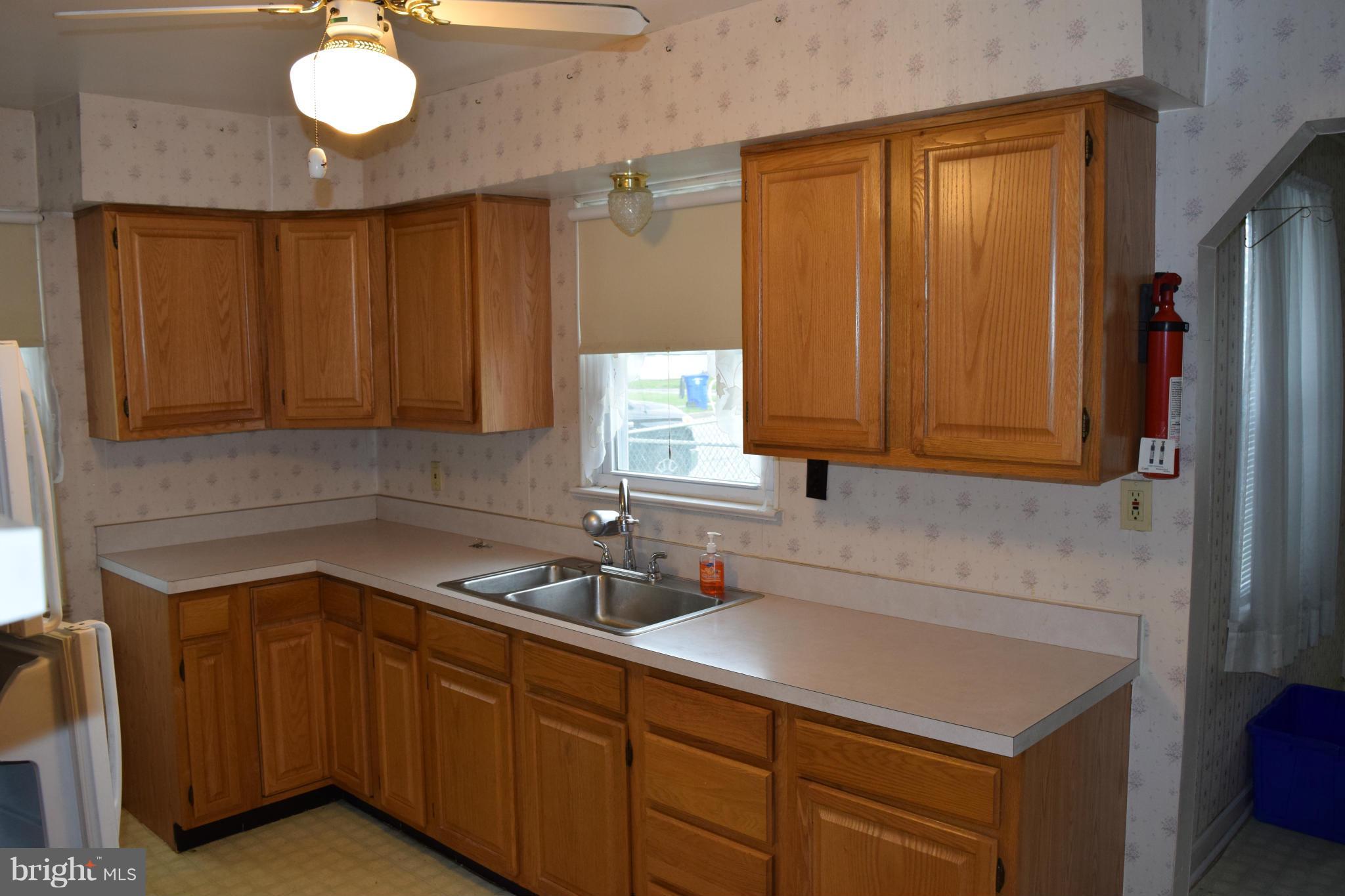 301 Nottingham Road Hagerstown, MD 21740 - Photo 4 of 11 a kitchen with a sink and cabinets