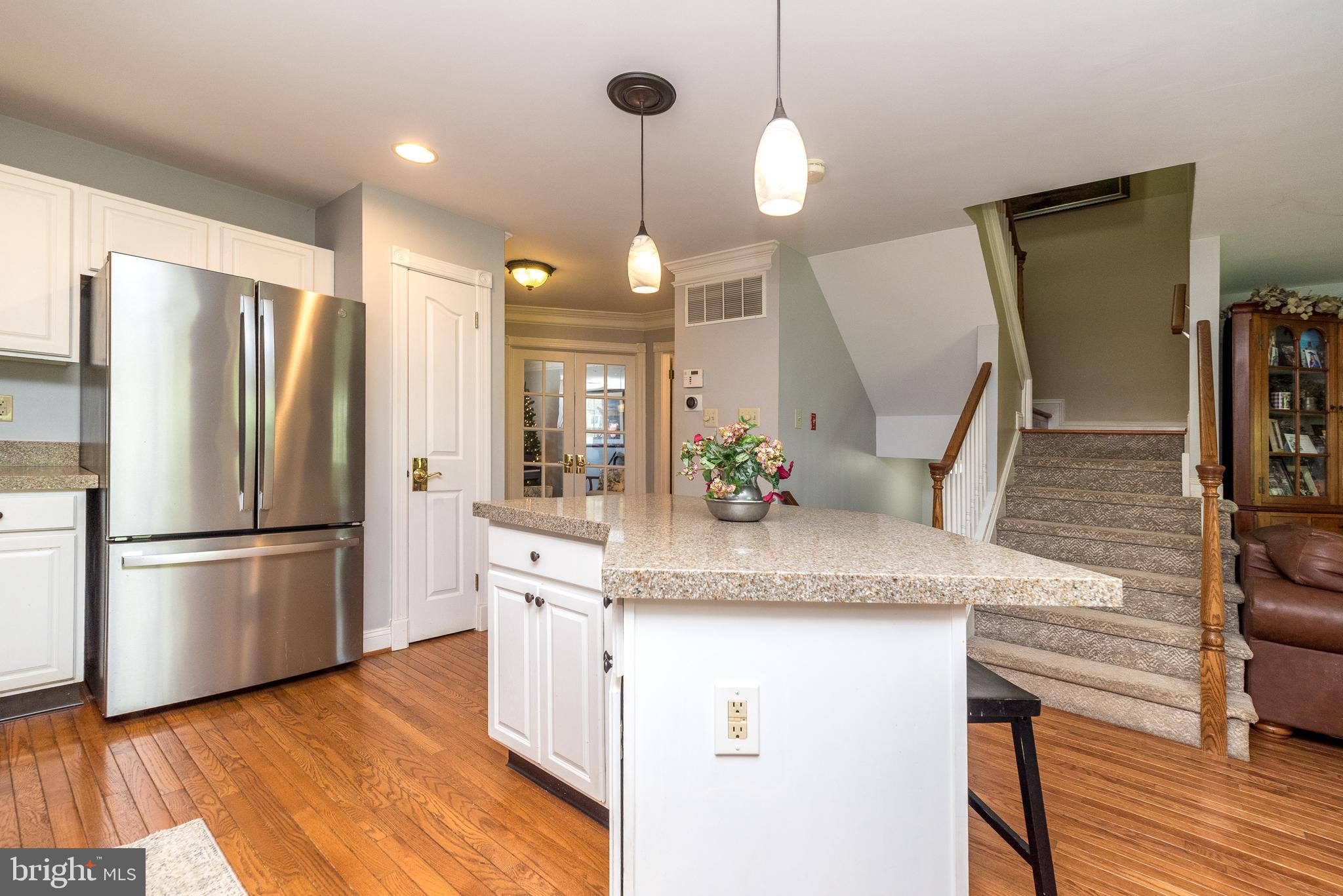 329 Manor Road Harleysville, PA 19438 - Photo 17 of 39 a kitchen with kitchen island white cabinets and stainless steel appliances