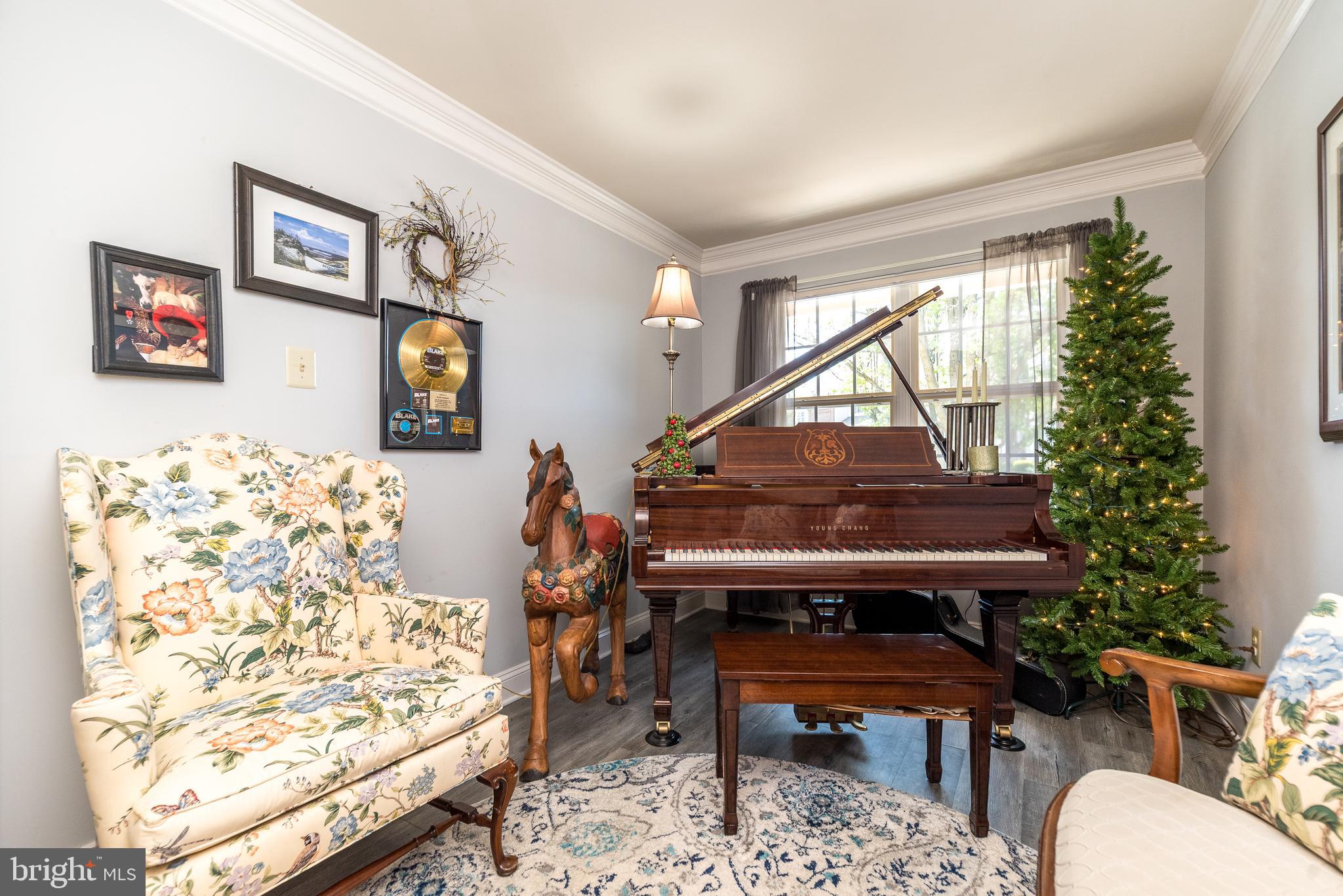 329 Manor Road Harleysville, PA 19438 - Photo 18 of 39 a living room with furniture and a piano