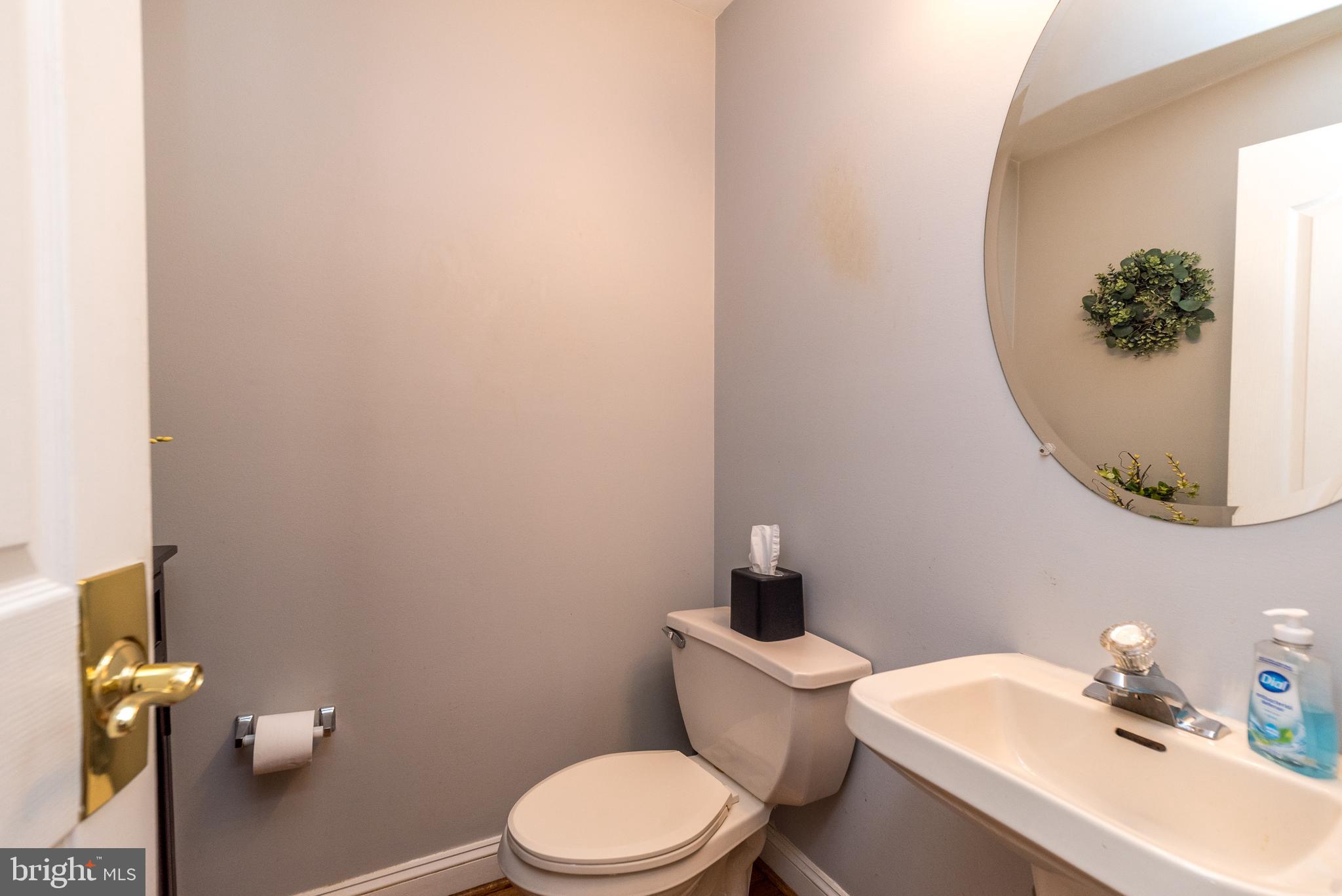 329 Manor Road Harleysville, PA 19438 - Photo 20 of 39 a bathroom with a toilet a sink and mirror