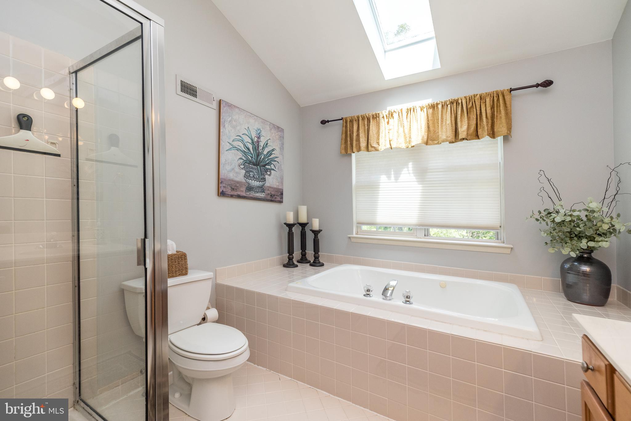 329 Manor Road Harleysville, PA 19438 - Photo 24 of 39 a bathroom with a bathtub and a toilet
