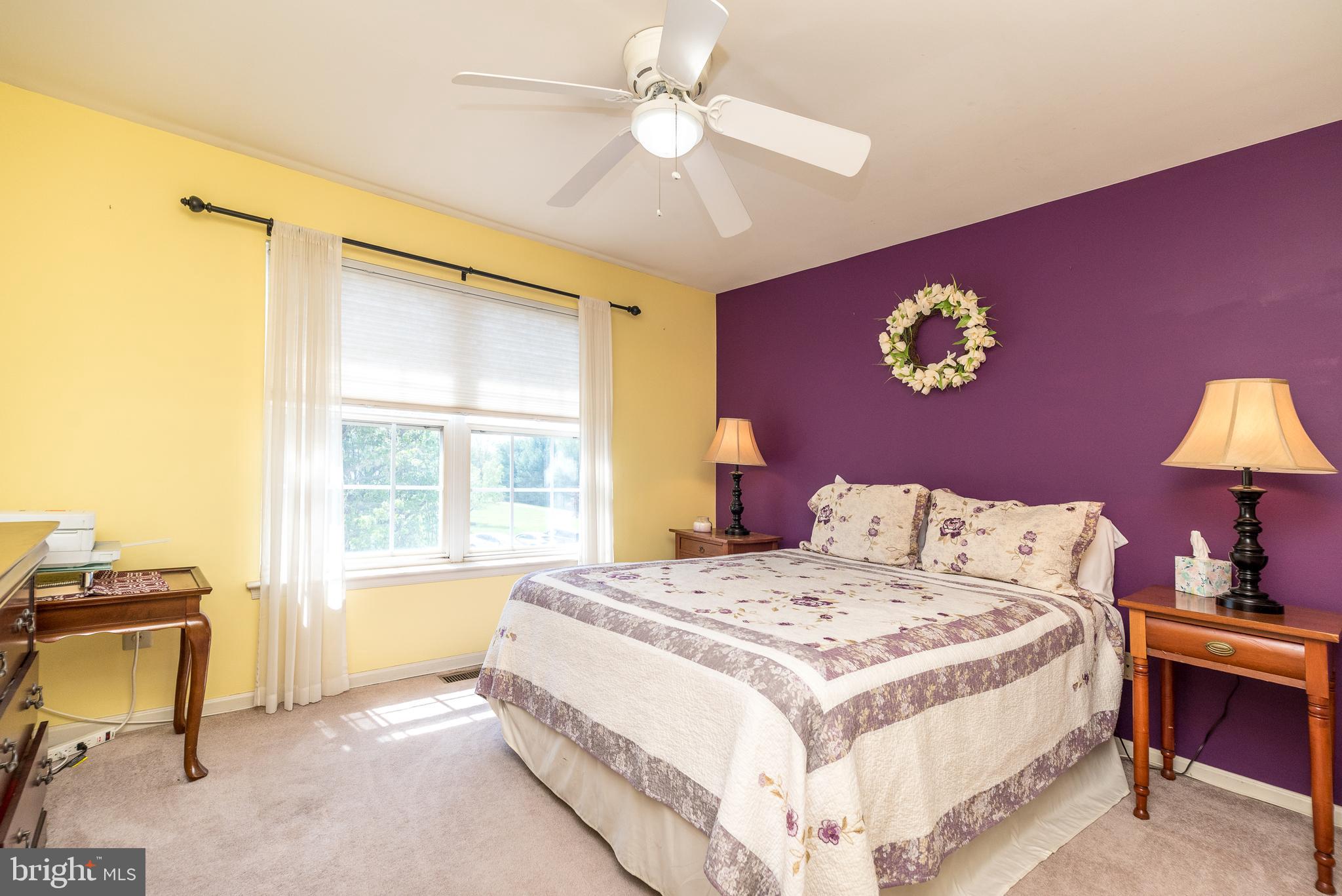 329 Manor Road Harleysville, PA 19438 - Photo 27 of 39 a bedroom with a bed and a chandelier