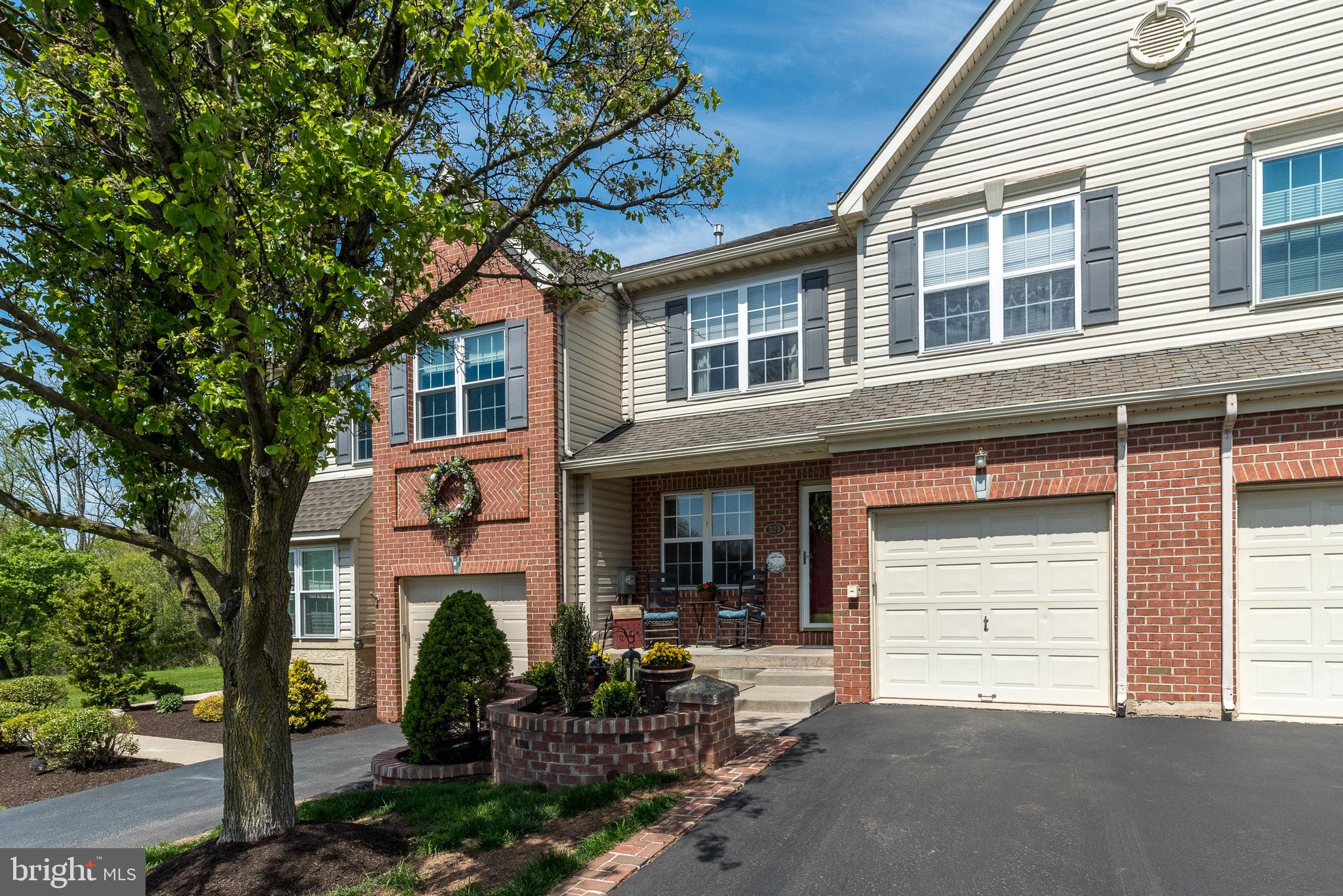 329 Manor Road Harleysville, PA 19438 - Photo 3 of 39 a front view of a house with garden