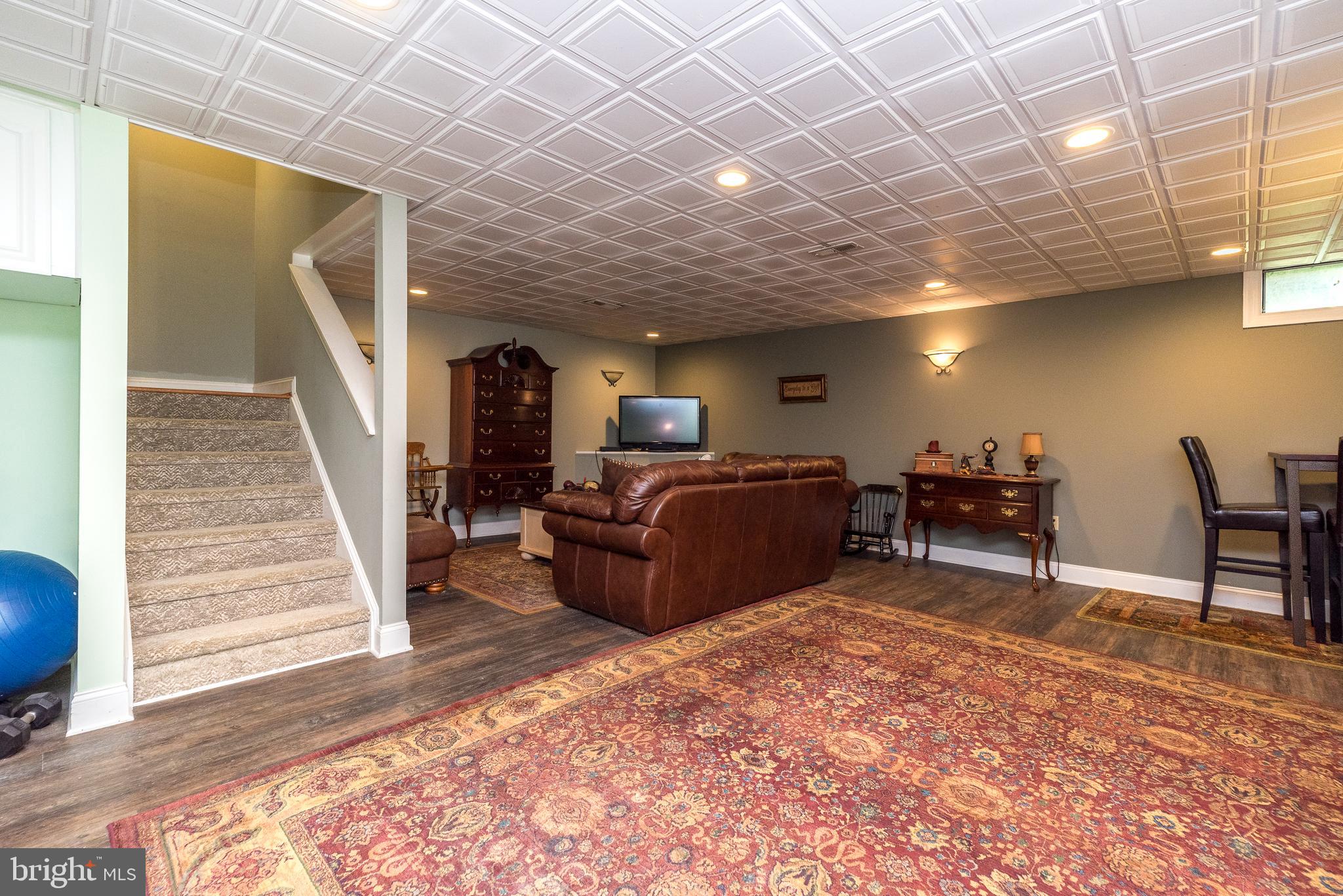 329 Manor Road Harleysville, PA 19438 - Photo 34 of 39 a living room with furniture and a wooden floor