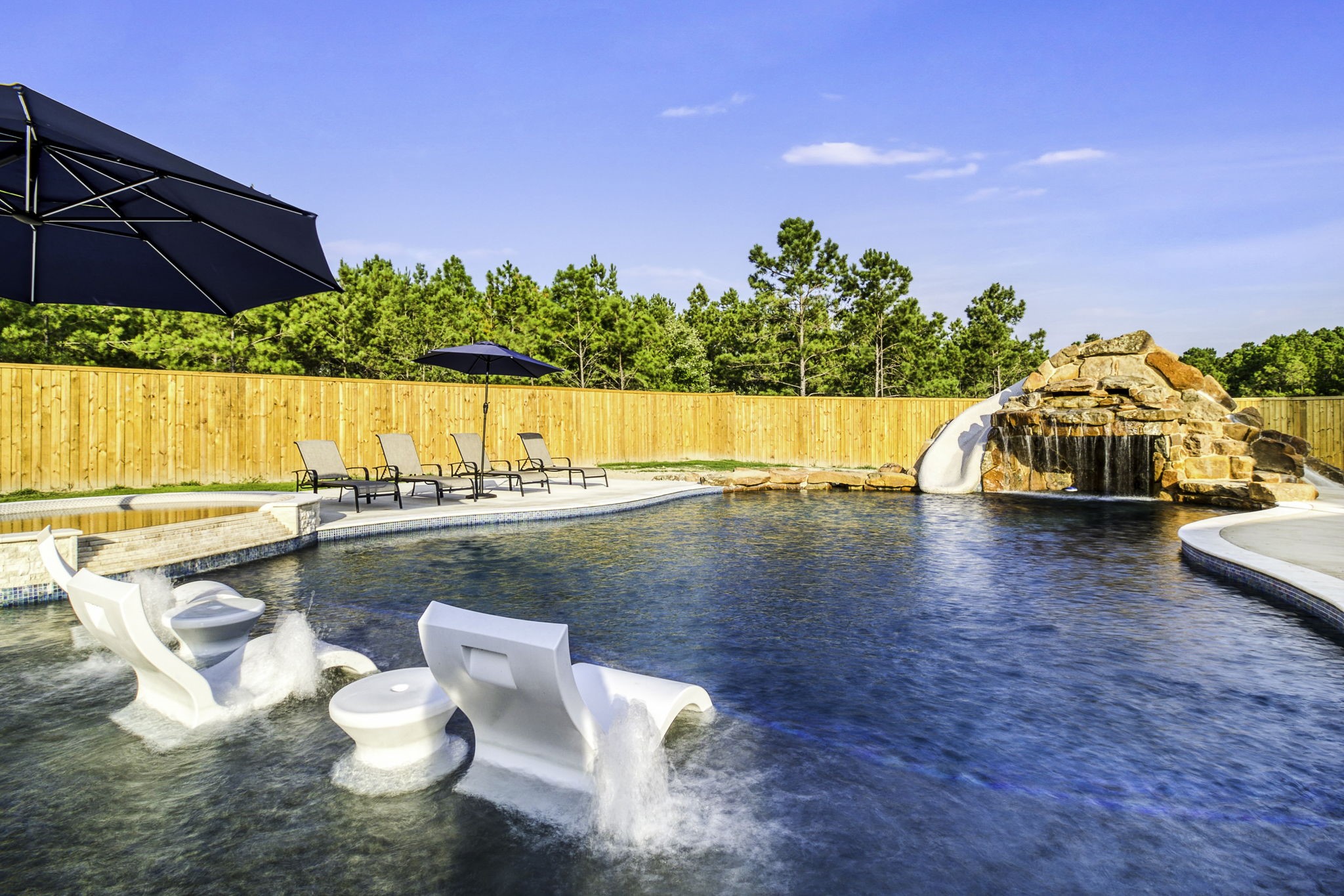 4602 Fm 3459 Road Onalaska, TX 77360 - Photo 44 of 45 a view of a swimming pool and lounge chair
