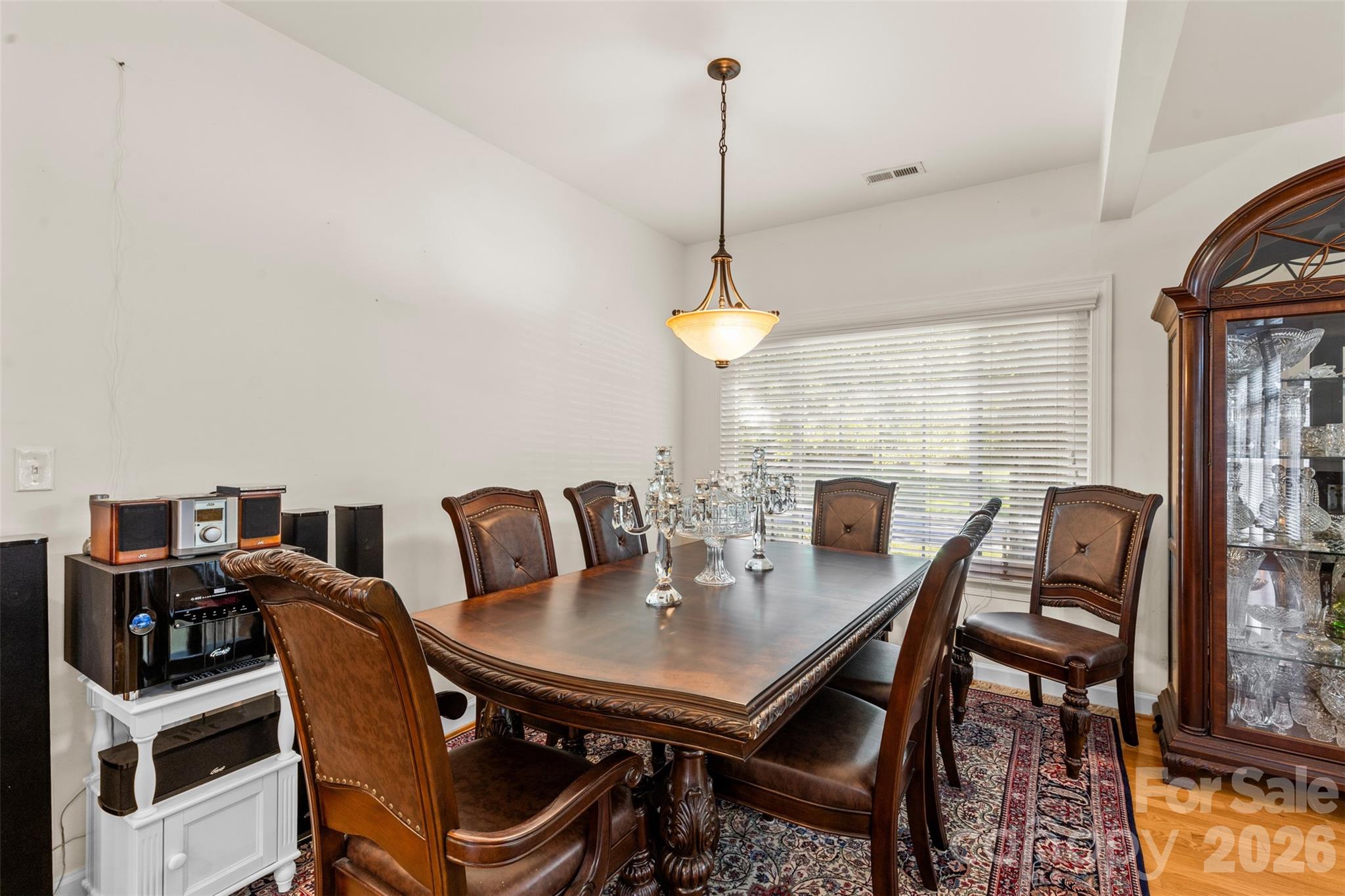 1337 Braeburn Road Northwest Concord, NC 28027 - Photo 11 of 36 a view of a dining room with furniture window and wooden floor