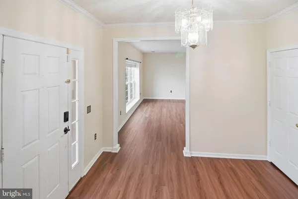 wooden floor in an empty room with a gallery