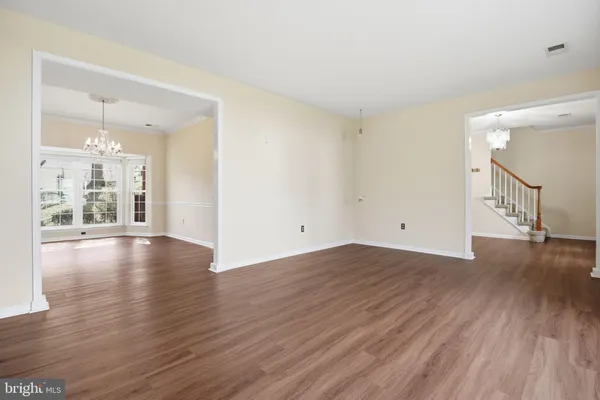 a view of a livingroom with wooden floor