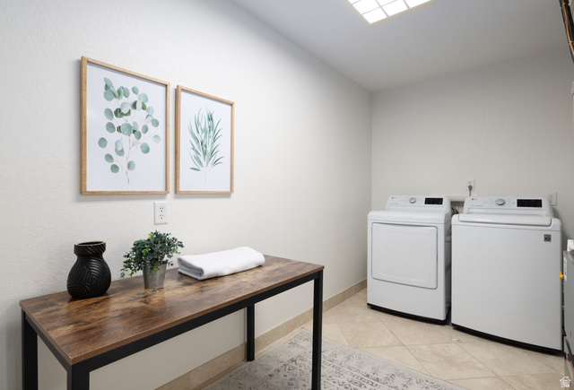 6936 South 775 East, Unit B Midvale, UT 84047 - Photo 11 of 33 Laundry area featuring washer and dryer and light tile patterned flooring