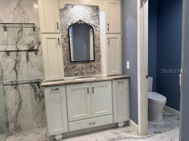 5511 Key W Place, Unit 5511 Bradenton, FL 34203 - Photo 18 of 38 a bathroom with a granite countertop sink and a mirror