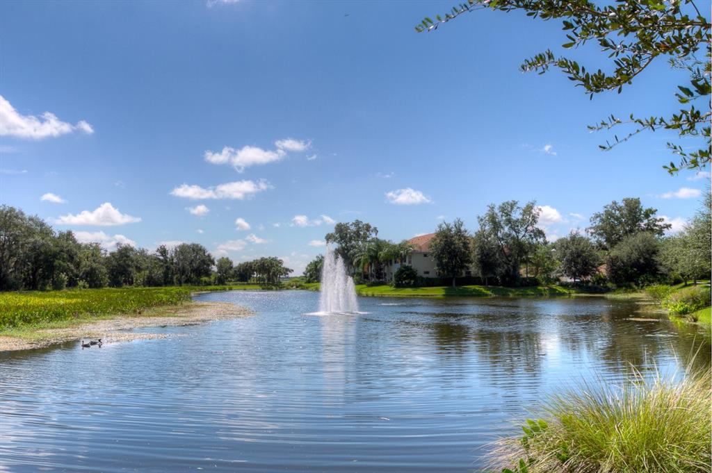 5511 Key W Place, Unit 5511 Bradenton, FL 34203 - Photo 29 of 38 a view of a lake with houses in background