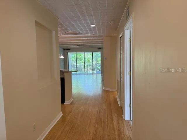 a view of a porch with a floor to ceiling window