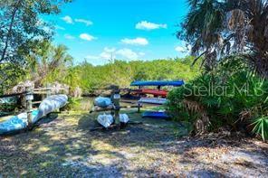 5511 Key W Place, Unit 5511 Bradenton, FL 34203 - Photo 37 of 38 a backyard of a house with table and chairs