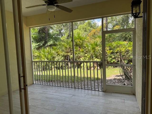 5511 Key W Place, Unit 5511 Bradenton, FL 34203 - Photo 5 of 38 a view of a porch with a floor to ceiling window