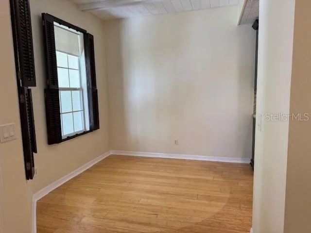 a view of a room that has a window in it
