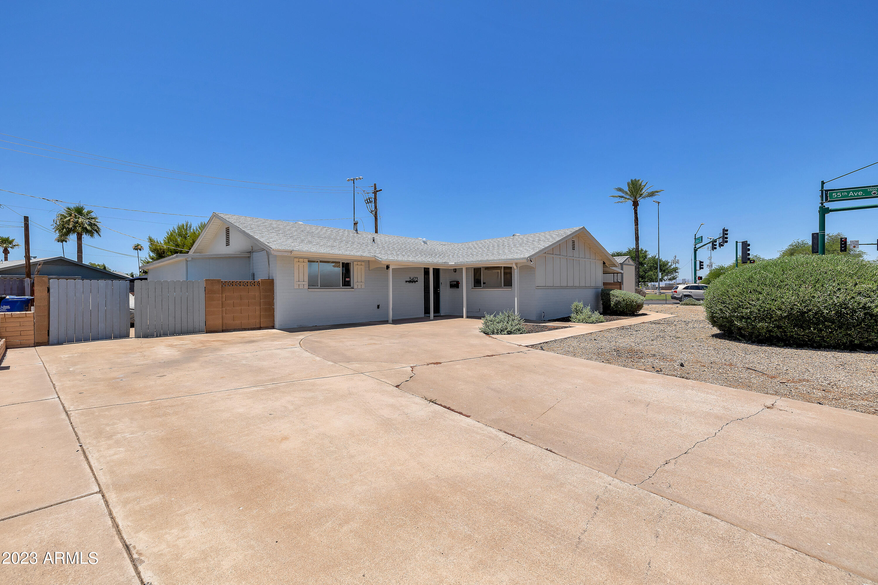 5473 West Osborn Road Phoenix, AZ 85031 - Photo 1 of 37 a big house with a big yard and large tree