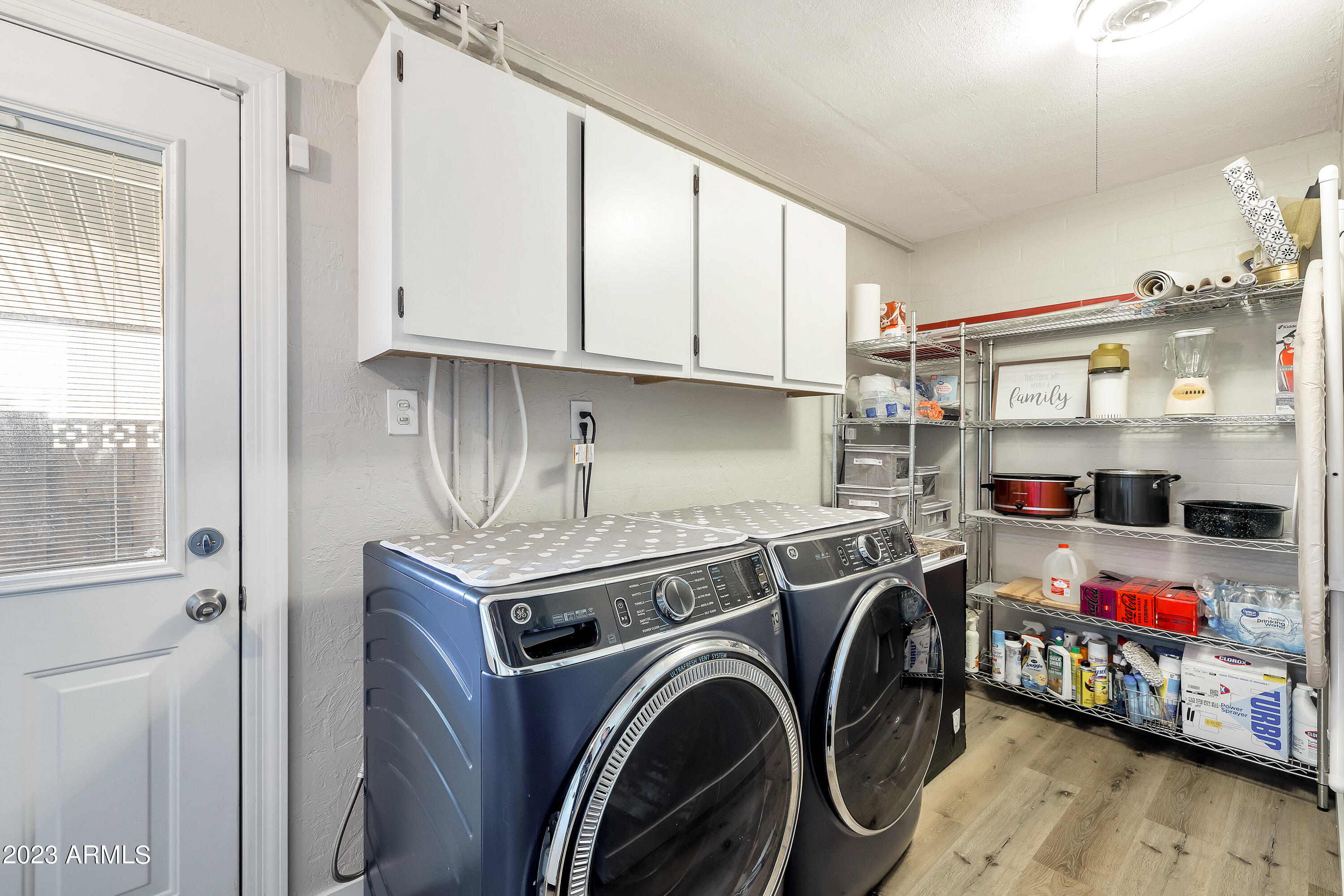 5473 West Osborn Road Phoenix, AZ 85031 - Photo 12 of 37 a utility room with dryer and washer