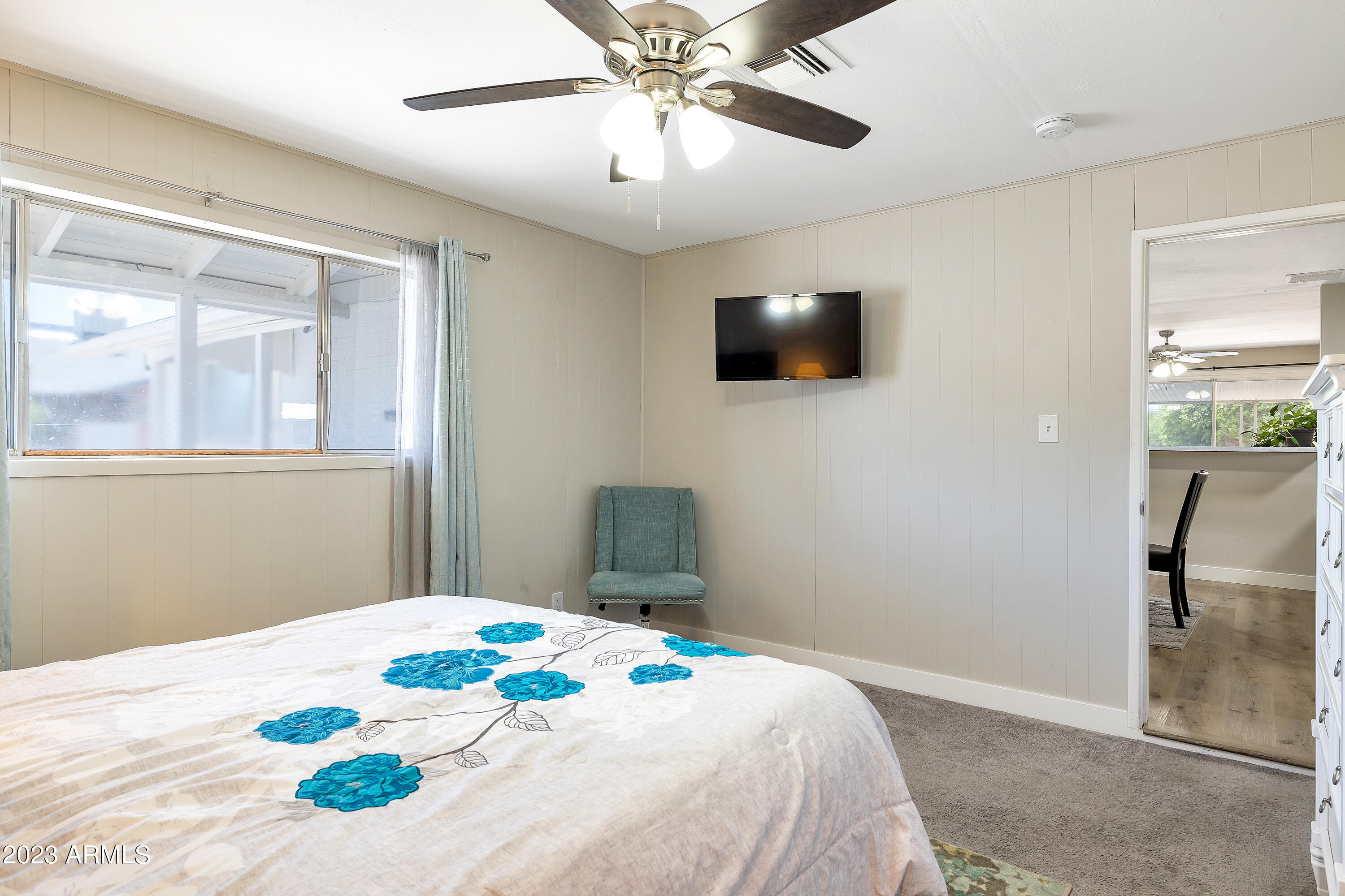 5473 West Osborn Road Phoenix, AZ 85031 - Photo 14 of 37 a bedroom with a bed and a flat screen tv