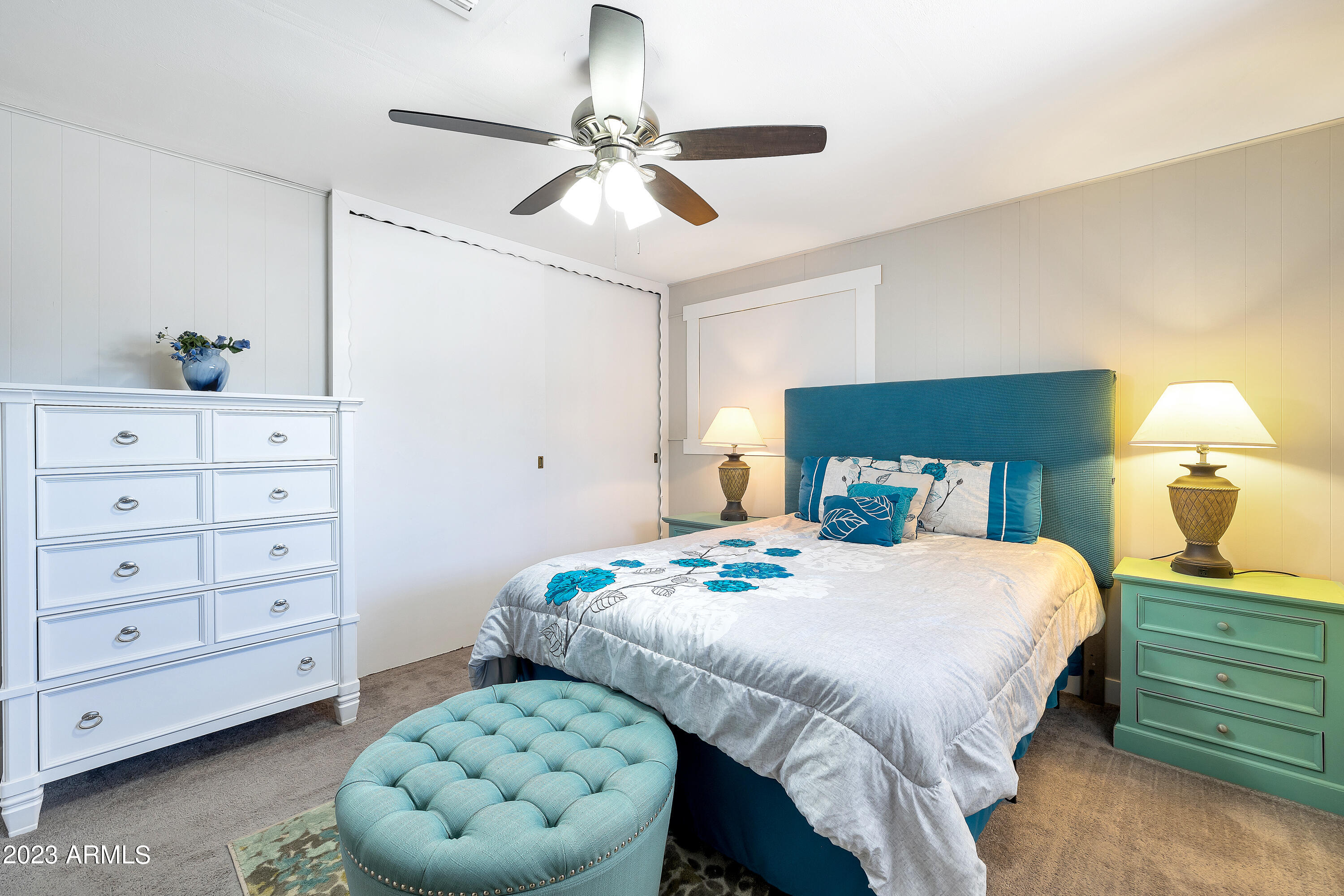 5473 West Osborn Road Phoenix, AZ 85031 - Photo 15 of 37 a bedroom with a bed and a dresser