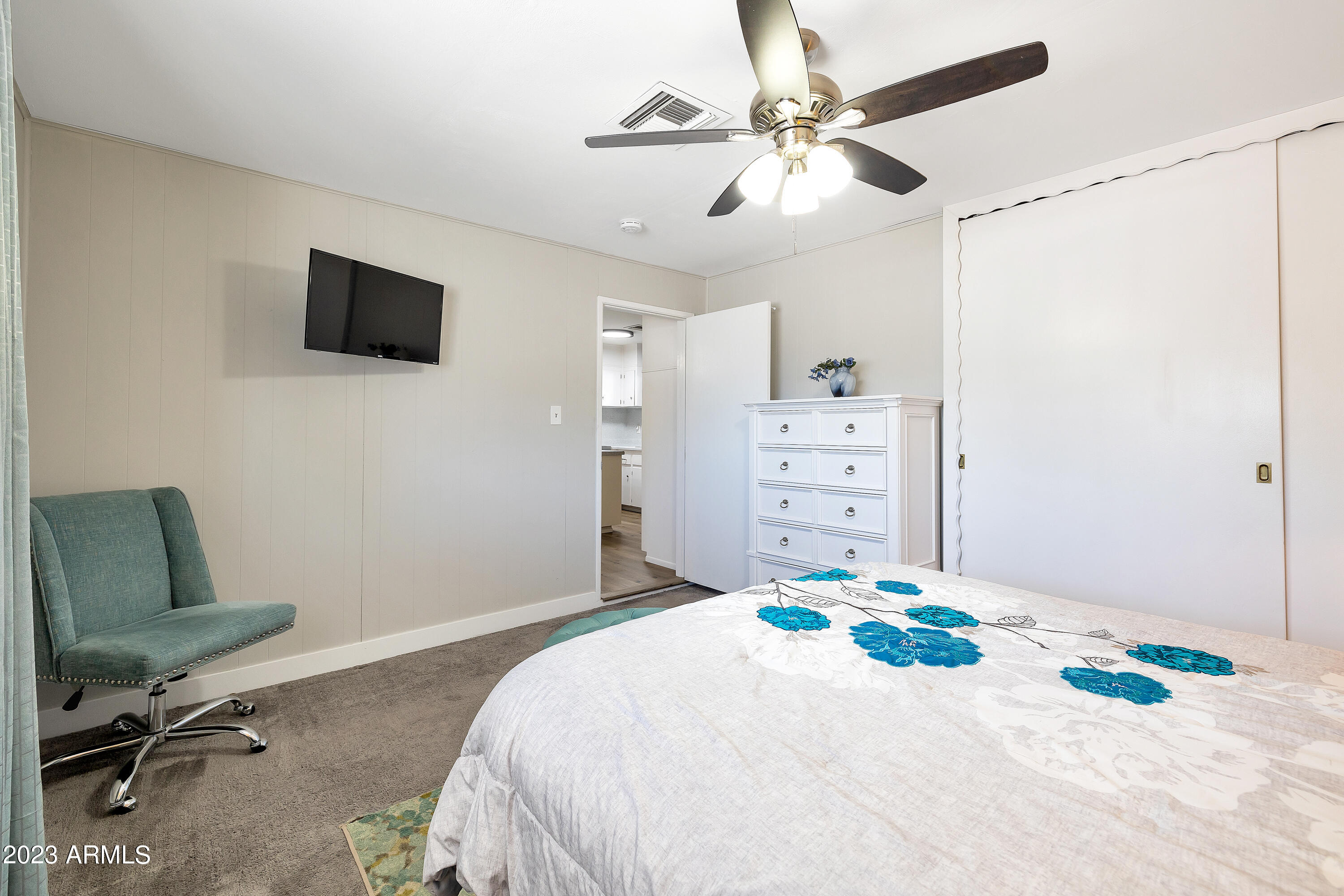 5473 West Osborn Road Phoenix, AZ 85031 - Photo 16 of 37 a bedroom with a bed dresser and a window