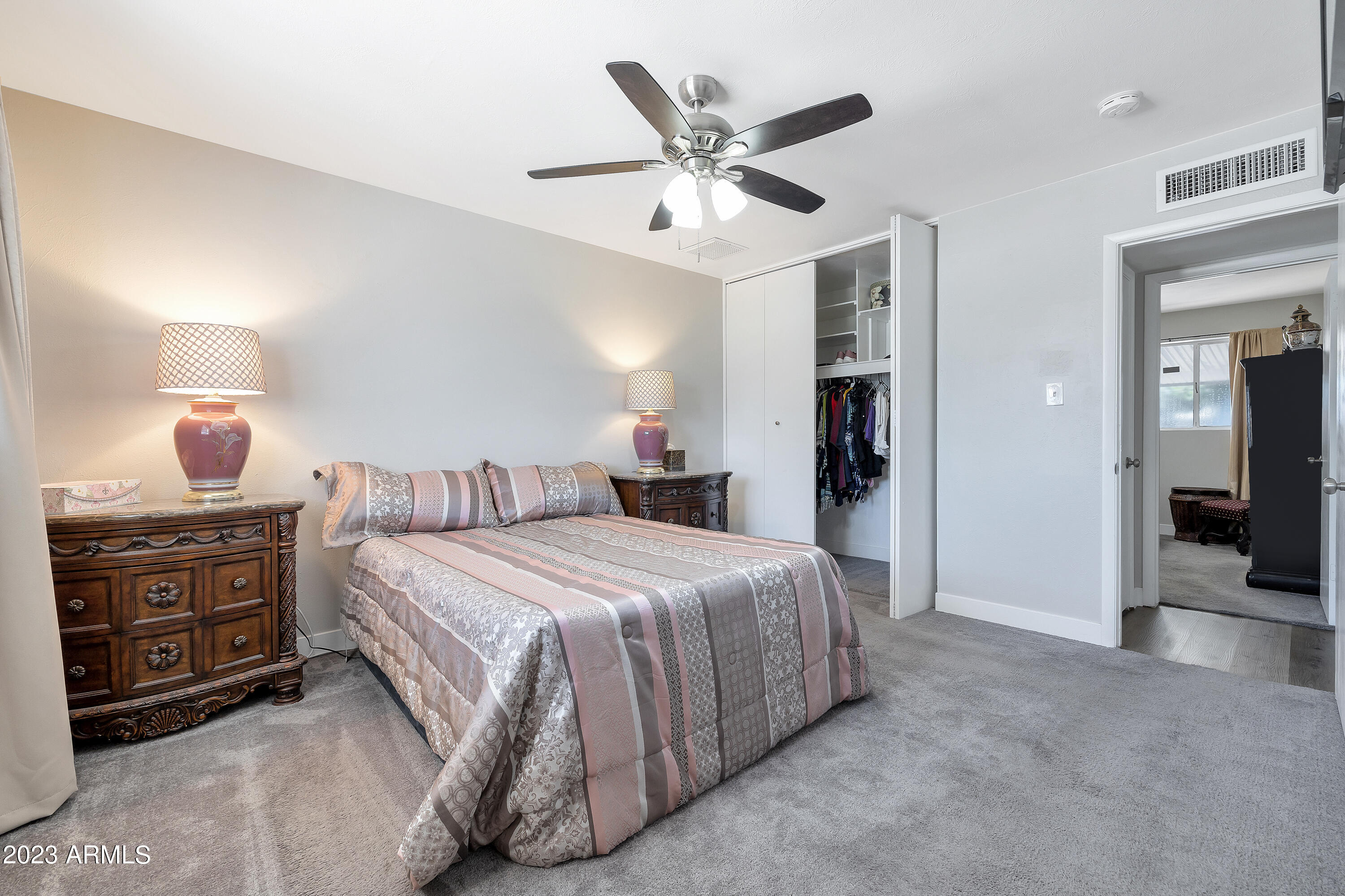 5473 West Osborn Road Phoenix, AZ 85031 - Photo 26 of 37 a bedroom with a bed and a tv on table