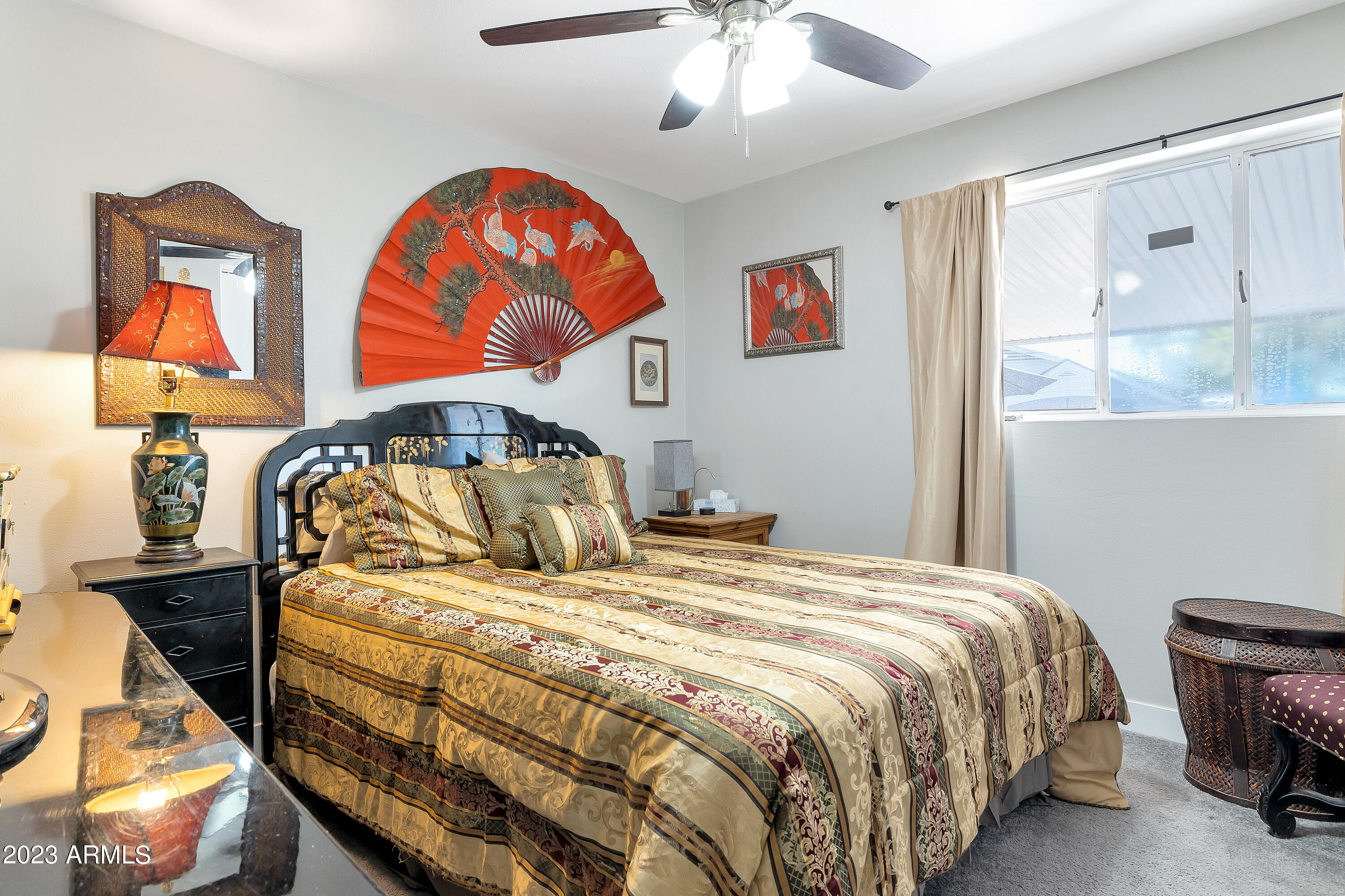 5473 West Osborn Road Phoenix, AZ 85031 - Photo 29 of 37 a bedroom with a bed and dresser